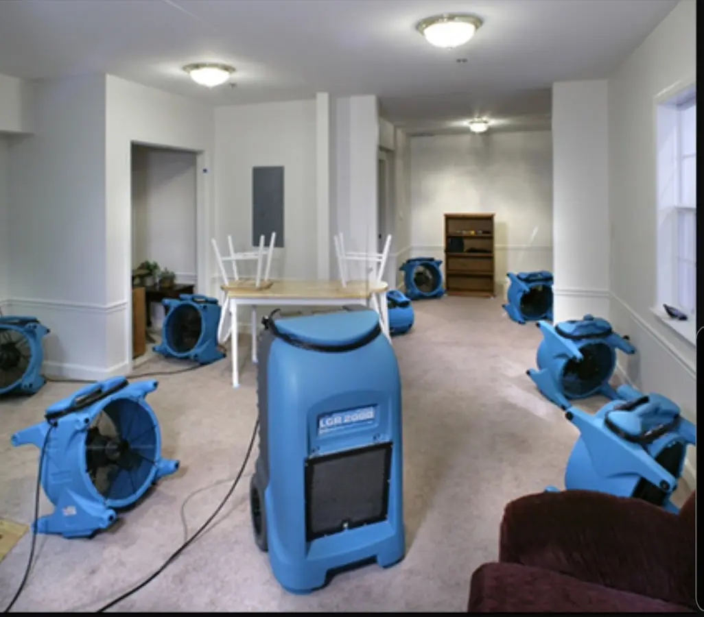 Air movers and dehumidifier setup for Water Damage Restoration in Zachary